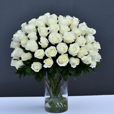 Purity  White Roses on a Glass Vase