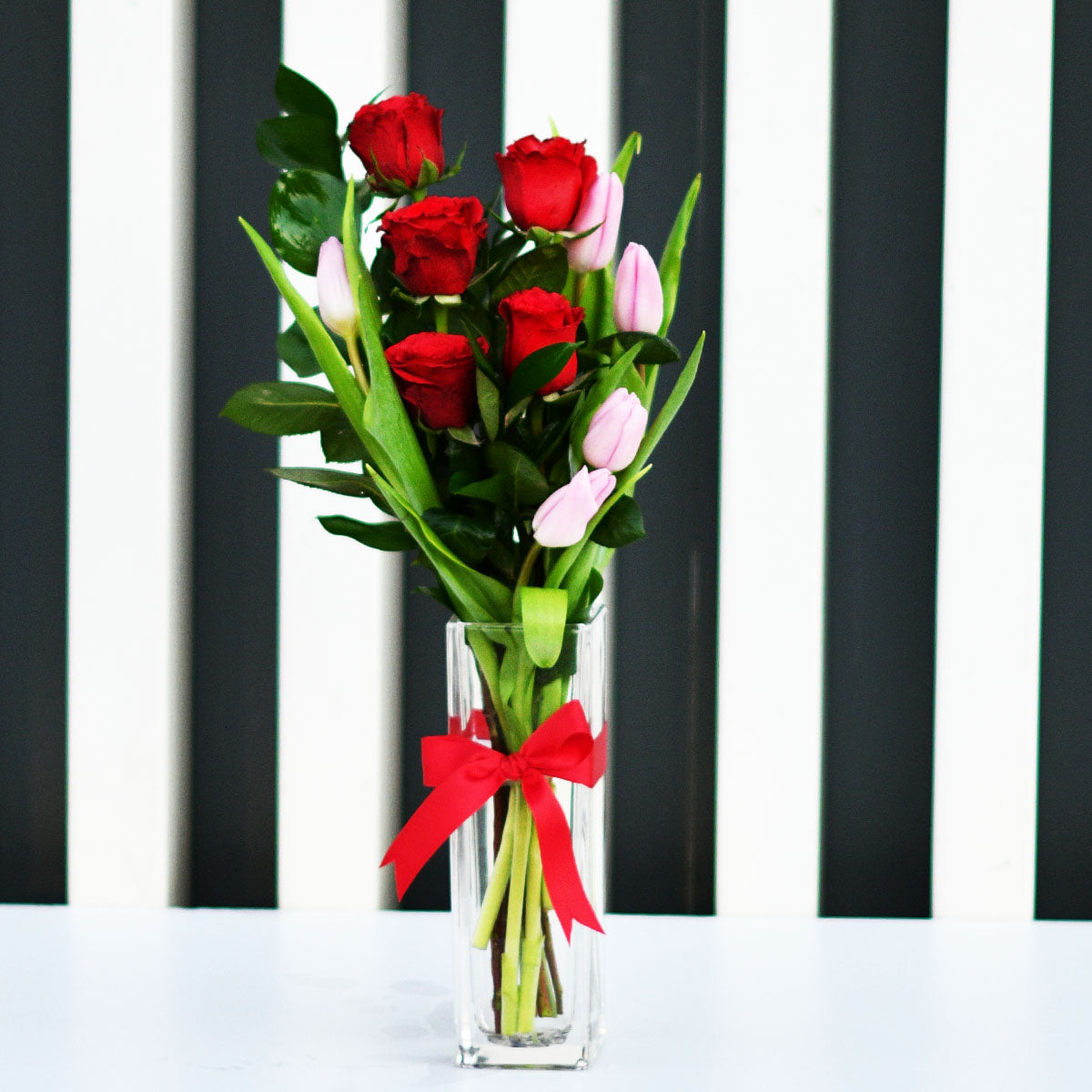 Red Roses & Tulip on a Glass Vase